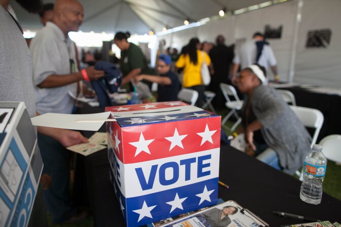 Local residents learn about the history of African-American voting in the US, review issues that will be on the ballot and register to vote during the 5th annual Power Fest Music and Art Festival in Martin Luther King Jr. Park on Saturday, Sept. 3, 2016.