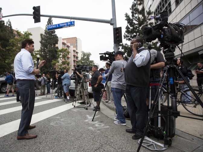 Media fill the intersection of Charles E. Young Drive South and Westwood Boulevard on Wednesday, June 1, 2016 following a murder-suicide on the University of California, Los Angeles campus.