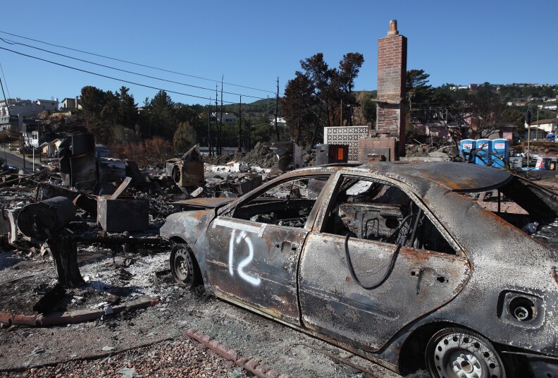 The shell of a car sits in the driveway of a burned home near the epicenter of the gas line explosion that devastated a neighborhood near San Francisco International Airport September 24, 2010 in San Bruno, California. Work crews continue to sift through rubble and residents are beginning the process of rebuilding their lives two weeks after the deadly San Bruno gas line explosion that killed seven people and destroyed dozens of homes.  