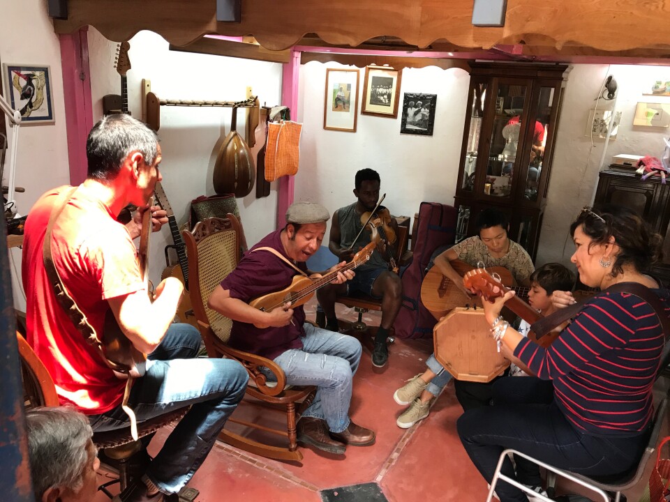 Ramón Gutierrez, center, is an instrument maker and leader of the band Grupo Mono Blanco.