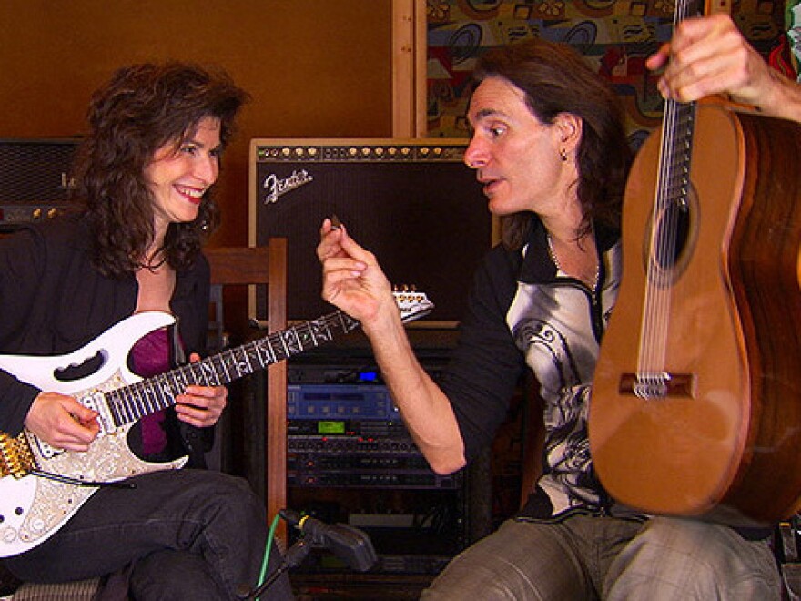 Sharon Isbin (left) and Steve Vai switch axes. 