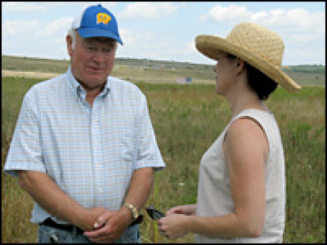 Jack Strong of Zanesville, Ohio, talks with Borza, standing in the field where Flight 93 went down.