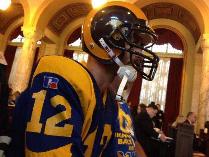 A profile of Griffin, dressed in football attire.