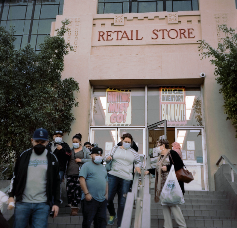 Customers outside the Boyle Heights Sears in March, 2021.