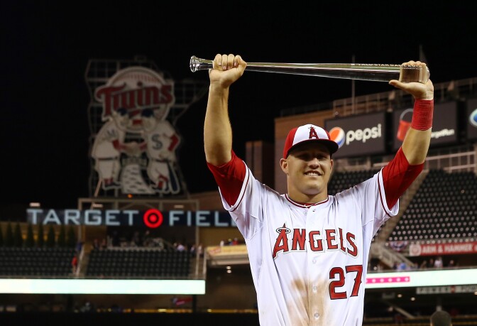 MINNEAPOLIS, MN - JULY 15:  American League All-Star Mike Trout #27 of the Los Angeles Angels poses with the MVP trophy after a 5-3 victory over the National League All-Stars during the 85th MLB All-Star Game at Target Field on July 15, 2014 in Minneapolis, Minnesota.  (Photo by Elsa/Getty Images)