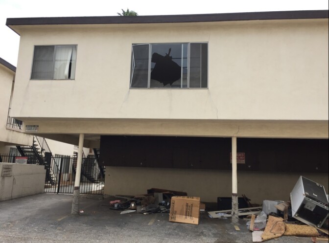 Vandals have hit abandoned apartment buildings littered with the belongings of past inhabitants. 