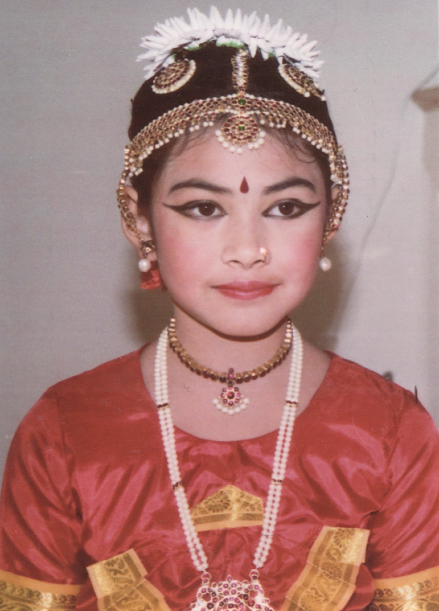 Anju at age 8, dressed for a dance performance.