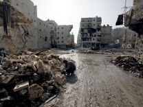 The U.S. and Germany said Friday that Russia must not provide the Assad regime with an advanced air defense system that they believe could prolong Syria's civil war. (Photo: A man is seen in the al-Amirya neighborhood of the city of Aleppo on December 2, 2012.) 