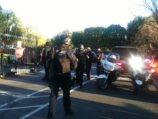 Swat teams suit up to sweep the SoCal Edison building.
