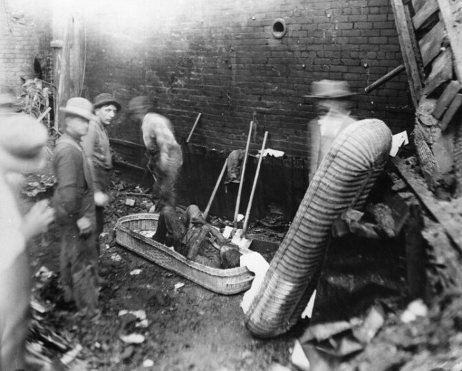 Recovery of victim from the rubble created by the 1910 bombing of the Los Angeles Times Building at First Street and Broadway. 