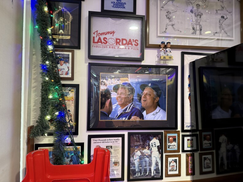 A wall at LaSorted's pizza restaurant in Chinatown is dedicated to Tommy Lasorda. It features a signed photograph of the former Dodger manager.