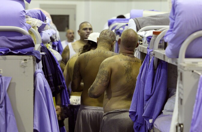 IONE, CA - AUGUST 28:  Inmates at the Mule Creek State Prison crowd between bunk beds in a gymnasium that was modified to house prisoners August 28, 2007 in Ione, California. A panel of three federal judges is looking to put a cap on the California State Prison population after class action lawsuits were filed on behalf of inmates who complained of being forced to live in classrooms, gymnasiums and other non-traditional prison housing. California prisons house nearly 173,000 inmates with over 17,000 of them in non-traditional housing. The Mule Creek State Prison has had to modify several facilities to make room for an increasing number of inmates. (Photo by Justin Sullivan/Getty Images)