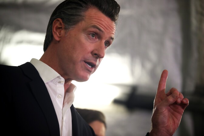 OAKLAND, CALIFORNIA - JANUARY 16: California Gov. Gavin Newsom speaks during a a news conference about the state's efforts on the homelessness crisis on January 16, 2020 in Oakland, California. Newsom was joined by Oakland Mayor Libby Schaaf to announce that Oakland will receive 15 unused FEMA trailers for the city to use as temporary housing and as mobile health and social services clinics for the homeless. Newsom signed on executive order on January 8 to deploy 100 trailers and crisis response teams to areas in need across the state.  (Photo by Justin Sullivan/Getty Images)