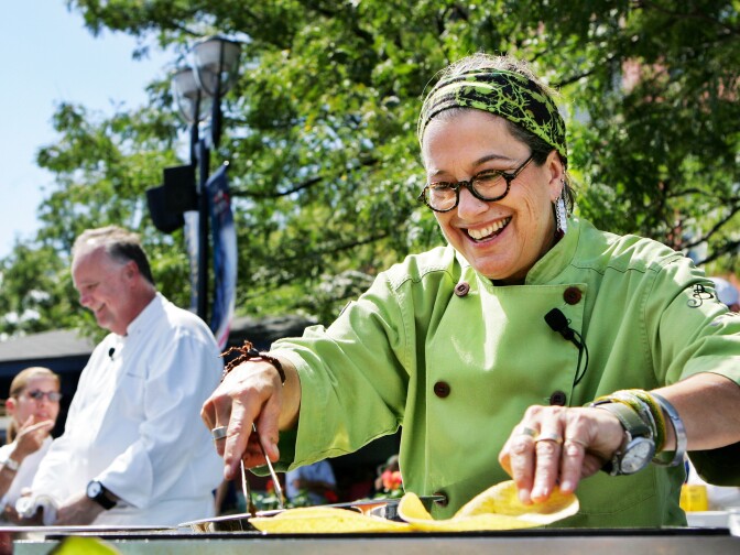 Susan Feniger, a chef from the Champions' Round of the most recent season of Top Chef Masters, smiles while making carne asada tacos during day six of the 2010 U.S. Open at the USTA Billie Jean King National Tennis Center on September 4, 2010 in the Flushing neighborhood of the Queens borough of New York City.  