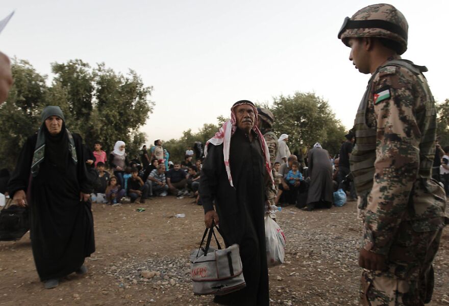 Jordanian soldiers help newly-arrived Syrian refugees after hundreds fleeing the violence in their home country. Most refugees have fled to neighboring countries, but some have ended up in Southern California.