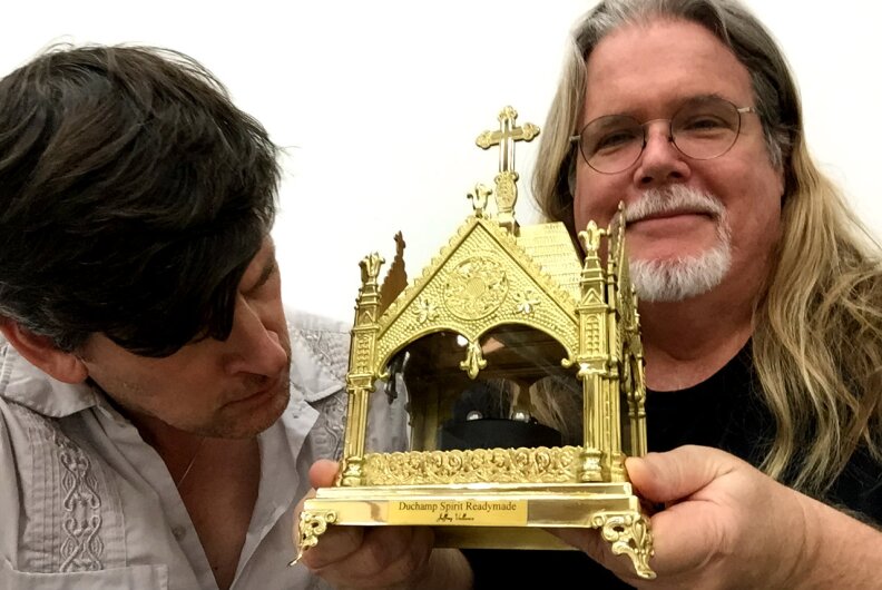 KPCC's John Rabe and Jeffrey Vallance with Vallance's "Duchamp Spirit Readymade," a reliquary showing off some Duchamp cufflinks.  The work is at CB1 Gallery in LA from July 25 through September 5, 2015.
