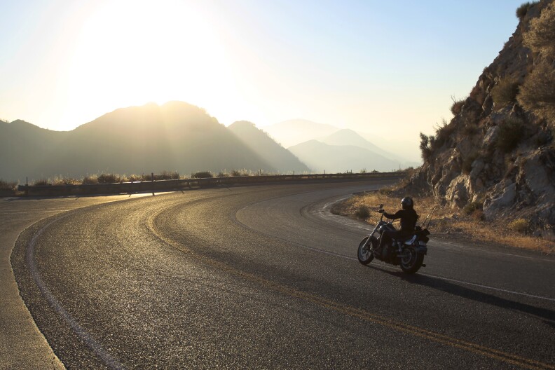 LOS ANGELES, CA - OCTOBER 2:  A motorcyclist rides the Angeles Crest Highway (State Route 2) in the Angeles National Forest on October 2, 2013 in the San Gabriel Mountains, northeast of Los Angeles, California. The Angeles Crest Highway (State Route 2) remains open but campgrounds and other recreation areas as well as services within the Angeles National Forest are closed for a second day due to the partial government shutdown as House Republicans demand that the Senate and President Obama give in to efforts to defund the Affordable Care Act law, also known as Obamacare.  (Photo by David McNew/Getty Images)