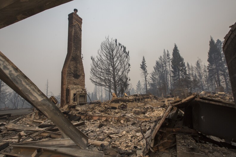 SANTA ROSA, CA - OCTOBER 10: A neighborhood is destroyed by fire in the area of Foxtail Court, on October 10, 2017 in Santa Rosa, California. In one of the worst wildfires in state history, at least 1,500 homes have burned and 11 people have died as more than 14 wildfires continue to spread in eight Northern California counties.   (Photo by David McNew/Getty Images)