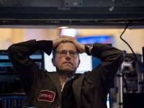 TOPSHOT - A trader works on the floor at the closing bell of the Dow Industrial Average at the New York Stock Exchange on February 5, 2018 in New York. 
Wall Street stocks endured a brutal session Monday, with the Dow seeing one of its steepest ever one-day point drops, as the heady bullishness of early 2018 gave way to extreme volatility. / AFP PHOTO / Bryan R. Smith        (Photo credit should read BRYAN R. SMITH/AFP/Getty Images)