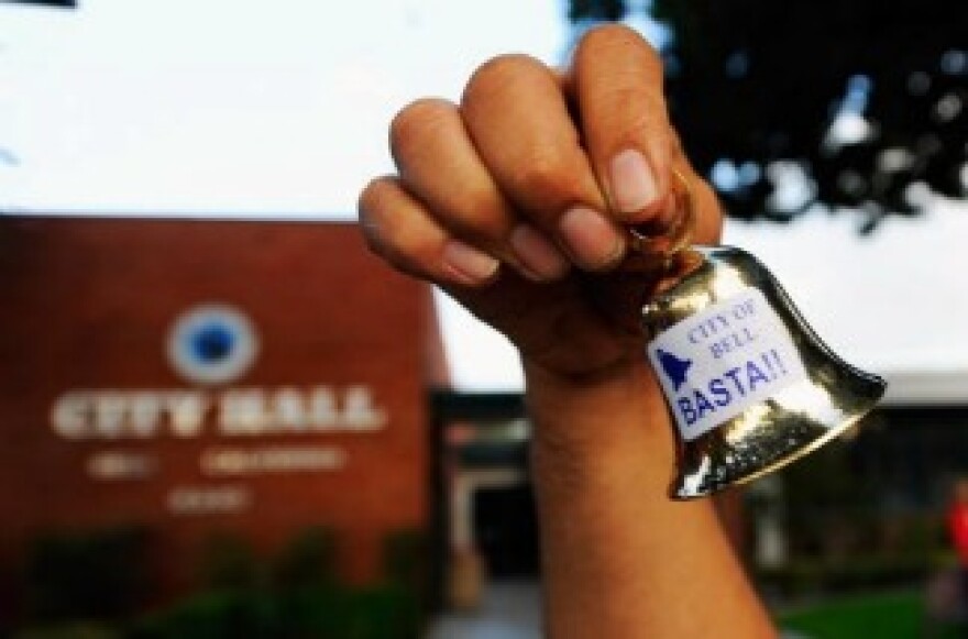 Residents celebrate the arrest of eight former and current city officials in front of Bell City Hall on September 21, 2010 in Los Angeles, California.