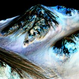 HALE CRATER, MARS - UNSPECIFIED DATE: In this handout provided by NASA's Mars Reconnaissance Orbiter, dark, narrow streaks on the slopes of Hale Crater are inferred to be formed by seasonal flow of water on surface of present-day Mars. These dark features on the slopes are called "recurring slope lineae" or RSL. Scientists reported on September 28, 2015 using observations with the Compact Reconnaissance Imaging Spectrometer on the same orbiter detected hydrated salts on these slopes at Hale Crater, corroborating the hypothesis that the streaks are formed by briny liquid water. (Photo by NASA/JPL-Caltech/Univ. of Arizona via Getty Images)