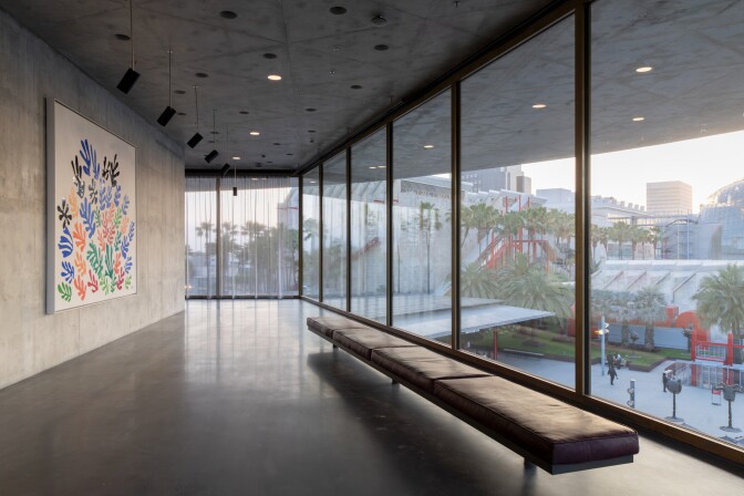 An art gallery with large windows.