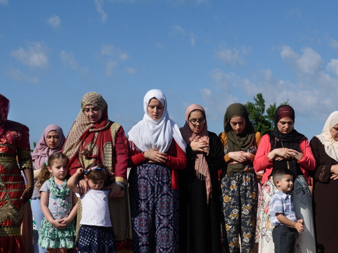 PITTSBURGH, PA - JUNE 25: Women stand in prayer during an Eid al-Fitr celebration, marking the end of Ramadan, on June 25, 2017 in Pittsburgh, Pennsylvania. The celebration marks the ending of the fasting month of Ramadan and the beginning of Shawwal and six more days of fasting.. Becasue Eid al-Fitr starts when the new moon is spotted, it is celebrated on different days around the world.   (Photo by Justin Merriman/Getty Images)