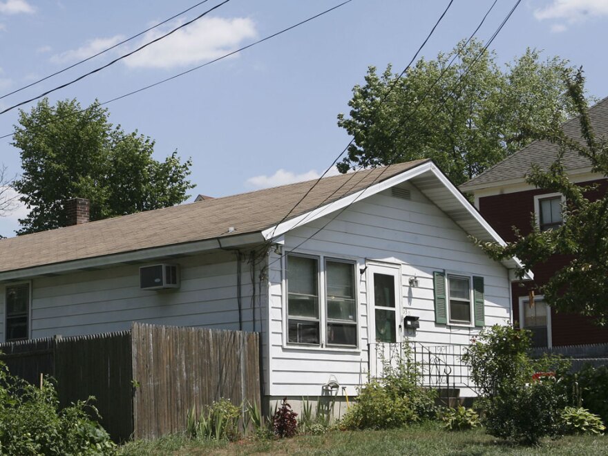 Beatrice Munyenyezi, 40, came to the U.S. in 1999 and lived in this home in Manchester, N.H. Federal prosecutors say Munyenyezi directed kidnapping, rape and murder during the 1994 Rwanda genocide, during which about 800,000 people were killed.