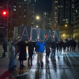 Demonstrators march through downtown following the release of a video showing Chicago Police officer Jason Van Dyke shooting and killing Laquan McDonald on November 24, 2015 in Chicago, Illinois. 