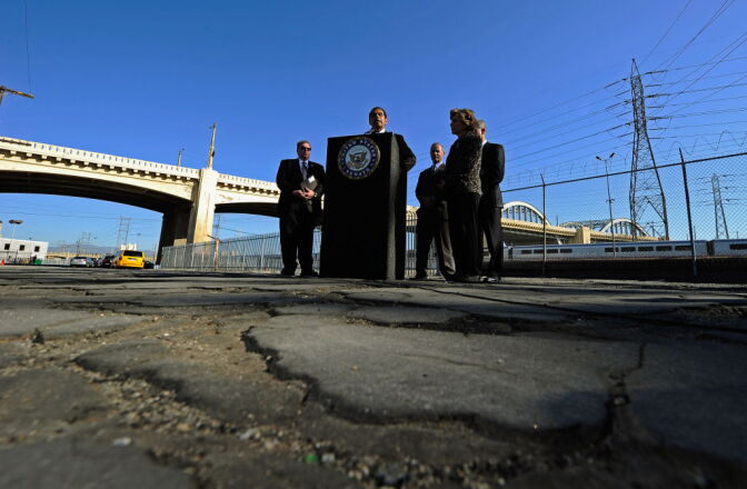 File: Former Los Angeles Mayor Antonio Villaraigosa speaks as U.S. Sen. Barbara Boxer (D-CA) and state and city officials listen on an industrial street with broken pavement at a news conference with with the Sixth Street bridge in the background on October 27, 2011 in Los Angeles, California. 