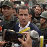 CARACAS, VENEZUELA - APRIL 30: Venezuelan opposition leader Juan Guaidó, recognized by many members of the international community as the country's rightful interim ruler, talks to media outside the airforce base La Carlota on April 30, 2019 in Caracas, Venezuela. Through a live broadcast via social media, Venezuelan opposition leader Juan Guaido called for a military uprising against the government of Nicolás Maduro. He declared to be at the air base of La Carlota and was seen surrounded by soldiers and opposition activist Leopoldo Lopez, who was under house arrest. (Photo by Rafael Briceno/Getty Images)