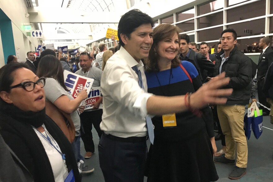 State Senate leader Kevin de Leõn poses with supporters moments after delegates finished voting for their endorsement picks at the California Democrats' state convention in San Diego.
