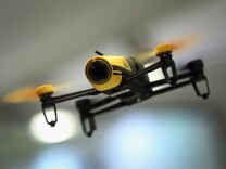 A Parrot Bebop quadcopter drone flies at the Parrot stand at the 2015 IFA consumer electronics and appliances trade fair on September 4, 2015.