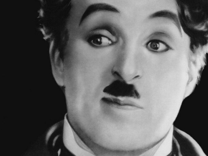 Movie still of Charlie Chaplin in the film, The Great Dictator.
