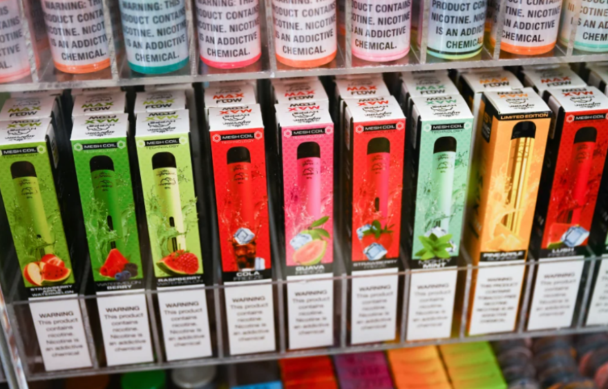 Different colored and flavored e-vapes are seen for sale.