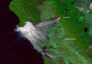 A massive plume of smoke travels west from a big fire, shown in red and labeled Camp Fire
