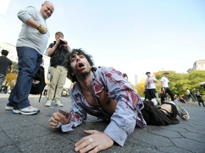 A zombie crawls through New York's Union Square during a promotion for the AMC network television series  <em>The Walking Dead.</em>