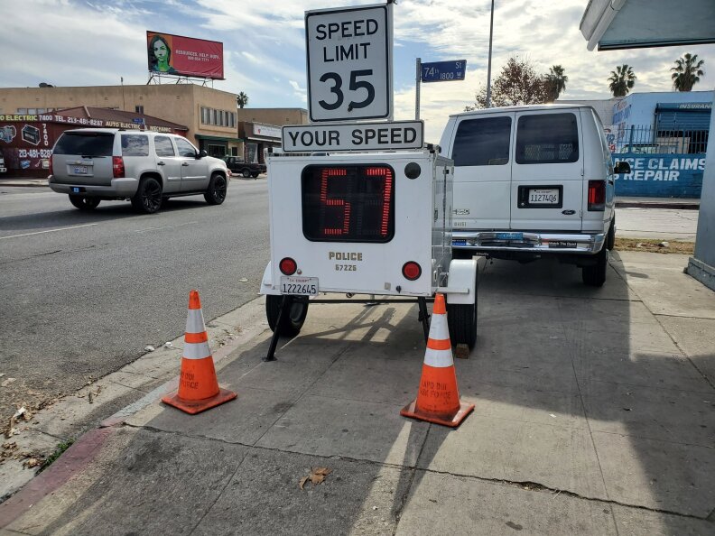 A speed feedback sign shows a driver was going 57 miles per hour on a street with a speed limit of 35 miles per hour.