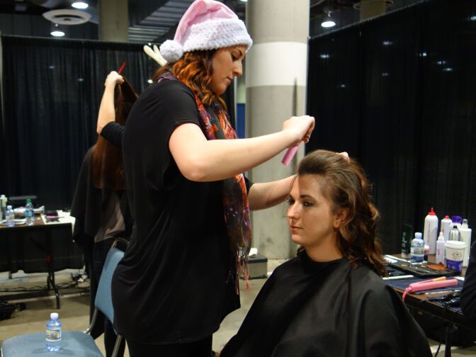 Air Force veteran Jennifer Yost gets her hair styled by a Paul Mitchell hairdresser at the Los Angeles Stand Down event at the Los Angeles Convention Center