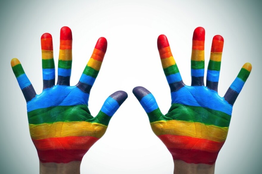 LGBT-rainbow-flag-hands.jpg