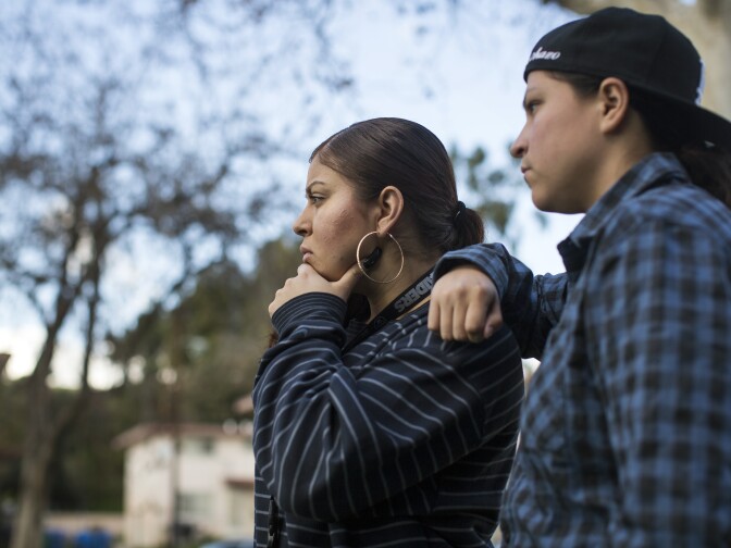 "We want them to see us as youth and not gang members" says Amanda Gutierrez, left, while looking at a mural memorializing a community member killed by police in the 1990s at Ramona Gardens in Boyle Heights on Friday, Jan. 13, 2017.