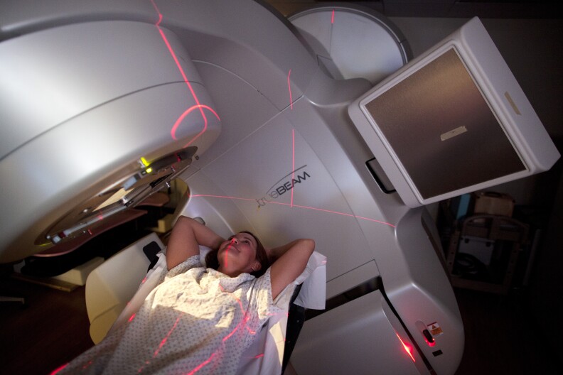 Stacey Bowles inside the machine that uses radiation to treat her for breast cancer at the UCLA Heath Center in Santa Monica. She opted for a double mastectomy when she learned she had cancer, but a new study suggests that in young women mastectomies often had no affect on mortality rates.
