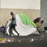 Tents house the homeless on a street, November 10, 2017 in Los Angeles, California, home to one of the nation's largest homeless populations, and where health officials are trying to ramp up efforts to stop the spread of Hepatitis A, as numbers are beginning to surge among gay and bisexual men, but not the homeless. The highly contagious liver disease can spread easily through homeless populations because of unsaintary conditions.
  / AFP PHOTO / FREDERIC J. BROWN        (Photo credit should read FREDERIC J. BROWN/AFP/Getty Images)