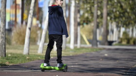 A boy rides a hoverboard on the day after Christmas, in San Pedro, Calif.. On Jan. 1, it became legal to cruise state streets via hoverboard.
