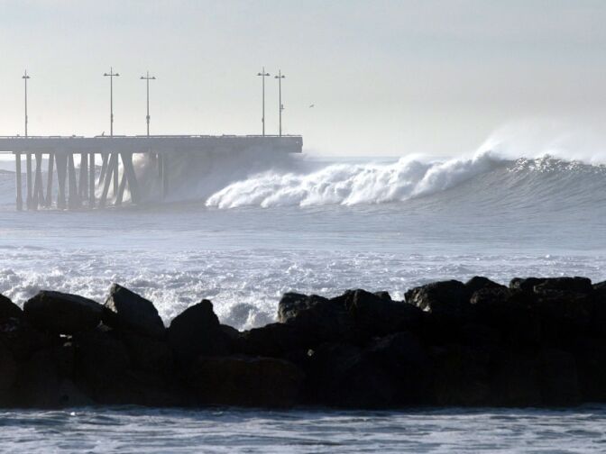 Large waves break at the Venice Beach Pier.