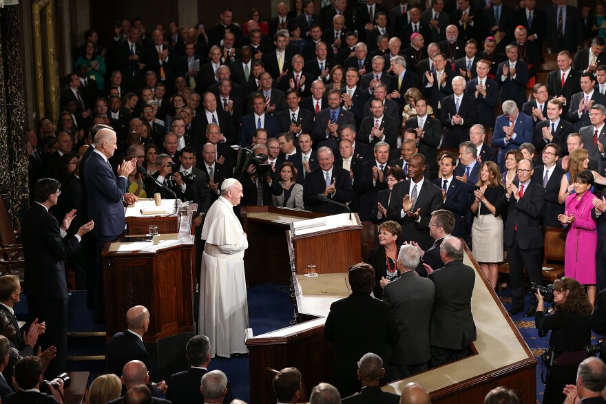 WASHINGTON, DC - SEPTEMBER 24:  Pope Francis is applauded by members of Congress as he arrives to speak during a joint meeting of the U.S. Congress in the House Chamber of the U.S. Capitol on September 24, 2015 in Washington, DC. Pope Francis is the first pope to address a joint meeting of Congress and will finish his tour of Washington later today before traveling to New York City. (Photo by Win McNamee/Getty Images)