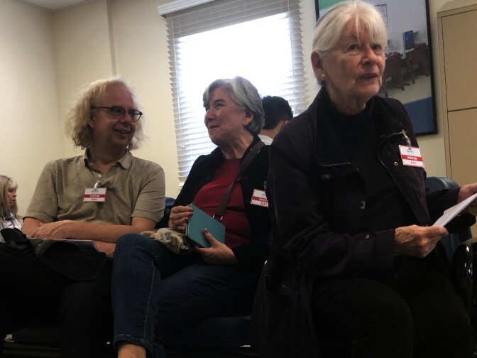 Arthur Kegerreis, Ecri Gutierrez and Edie Salisbury wait and prepare to visit immigrant detainees inside the women’s wing of the Adelanto Detention Center. 
