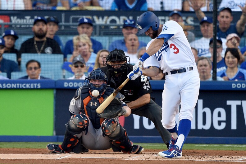 Los Angeles Dodgers' Chris Taylor hits a solo home run during the first inning against the Houston Astros in game one of the 2017 World Series at Dodger Stadium on Oct. 24, 2017.