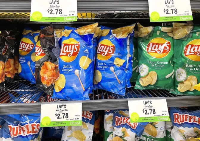 An image of various chip brands on the shelf in a store 