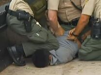 A screen shot from the video that captured the sheriff's deputy stomping on a suspect's head.